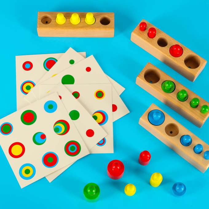 Montessori wooden cylinder weights colourful