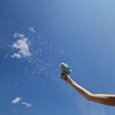 Soap bubble gun soap bubbles with wings blue